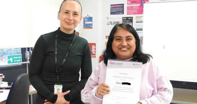 Sheetal receiving her certificate, presented by Amy McManus.